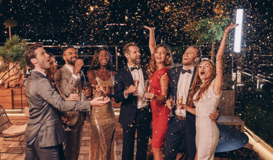 A lively group of people celebrating together at a New Year’s party at RipTydz in Myrtle Beach.