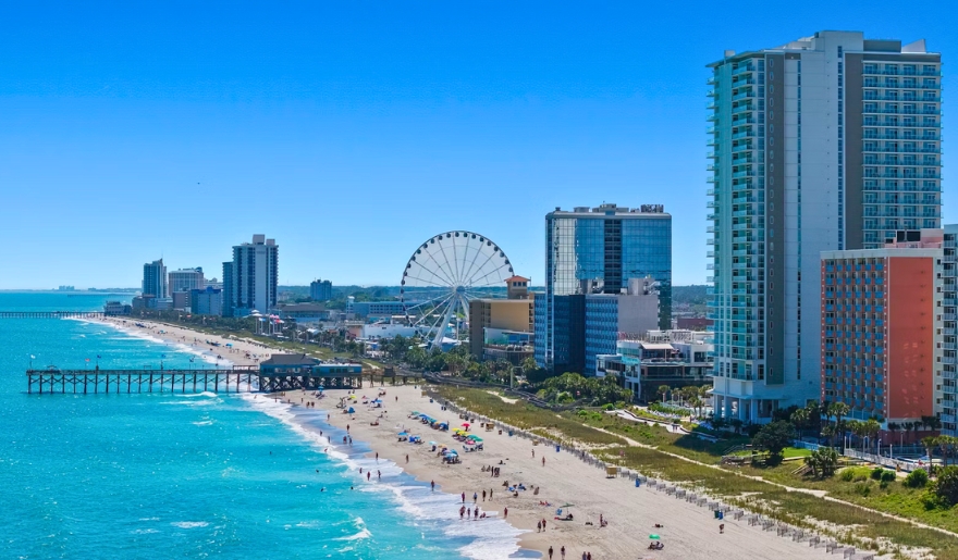 Myrtle Beach, SC, featuring a vibrant beach scene with seasonal decorations and festive atmosphere.
