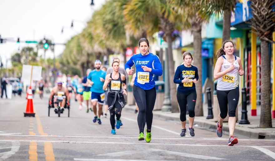 Participants running in a marathon at Myrtle Beach, highlighting the vibrant local events and festivals in March.