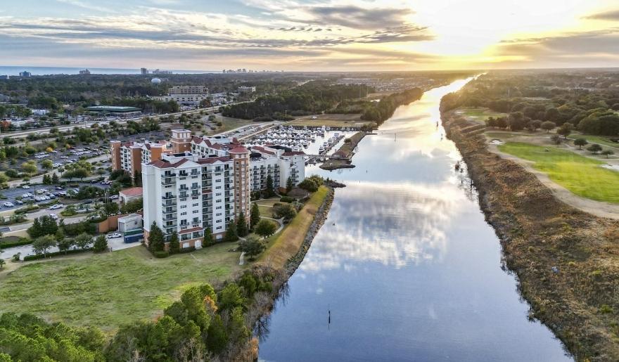 Aerial view of Marina Inn at Grande Dunes along Intracoastal Waterway at sunset