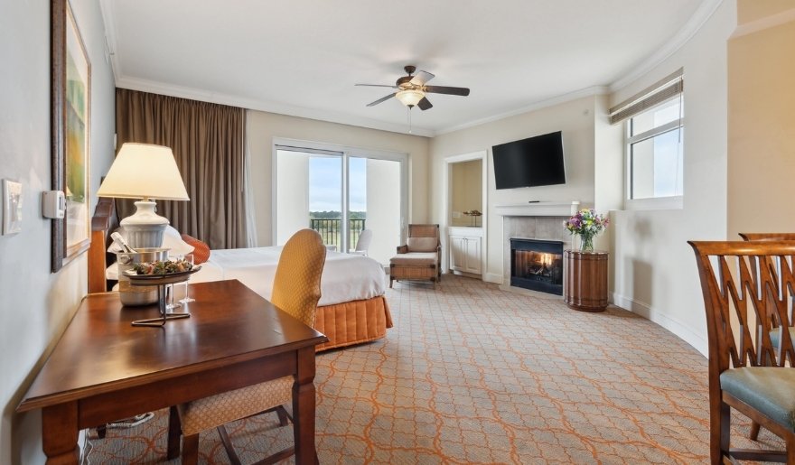 Elegant guest suite with fireplace and balcony at Marina Inn at Grande Dunes, perfect stay for Myrtle Beach 7 Day Itinerary