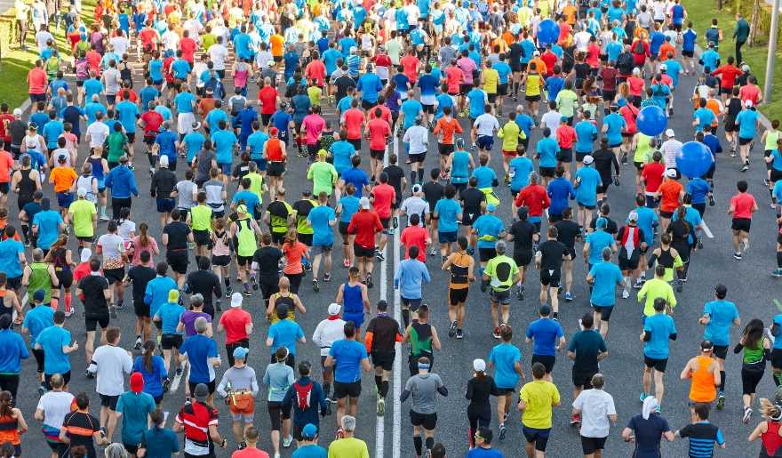A diverse crowd of runners in the Myrtle Beach Christmas 5K, showcasing community spirit during the holiday season.