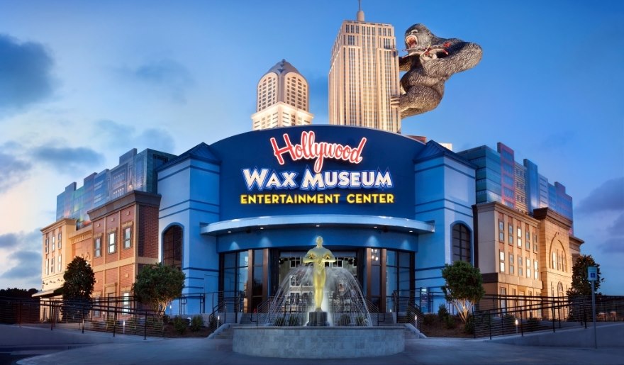 Exterior view of the Hollywood Wax Museum in Myrtle Beach, showcasing life-sized wax figures of celebrities and attractions.