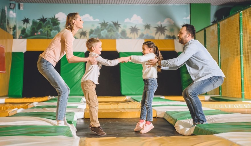 Joyful family enjoying trampoline fun at Big Air Trampoline Park, Myrtle Beach, creating lasting vacation memories.