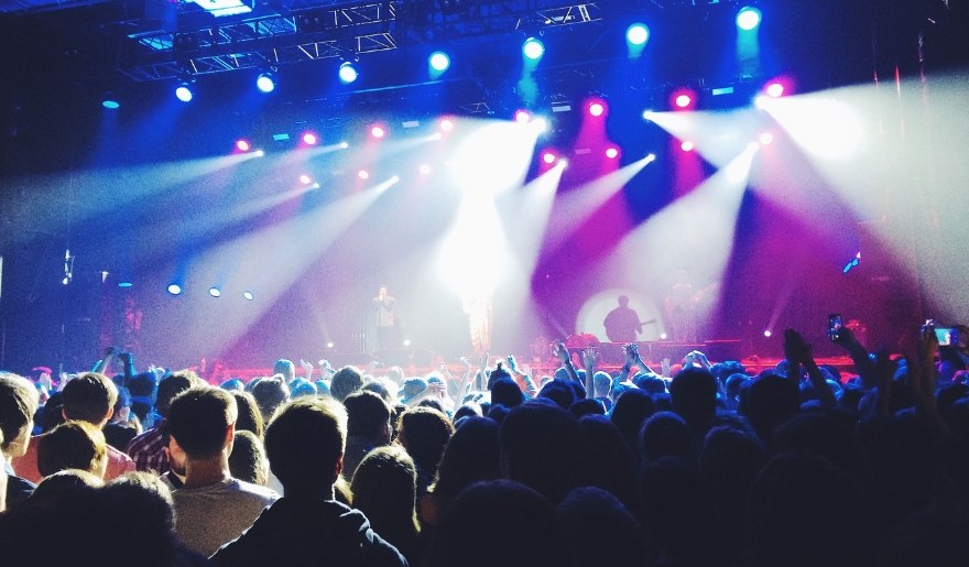 A lively audience at House of Blues for Corey Smith's concert, with dazzling lights creating an energetic atmosphere in Myrtle Beach.
