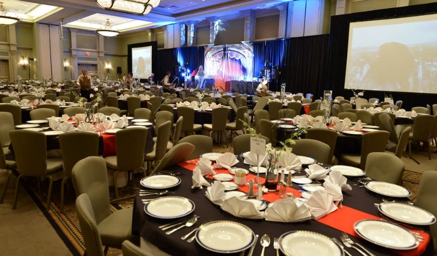 A spacious banquet room set up with tables and chairs, perfect for business meetings and special events in Myrtle Beach.