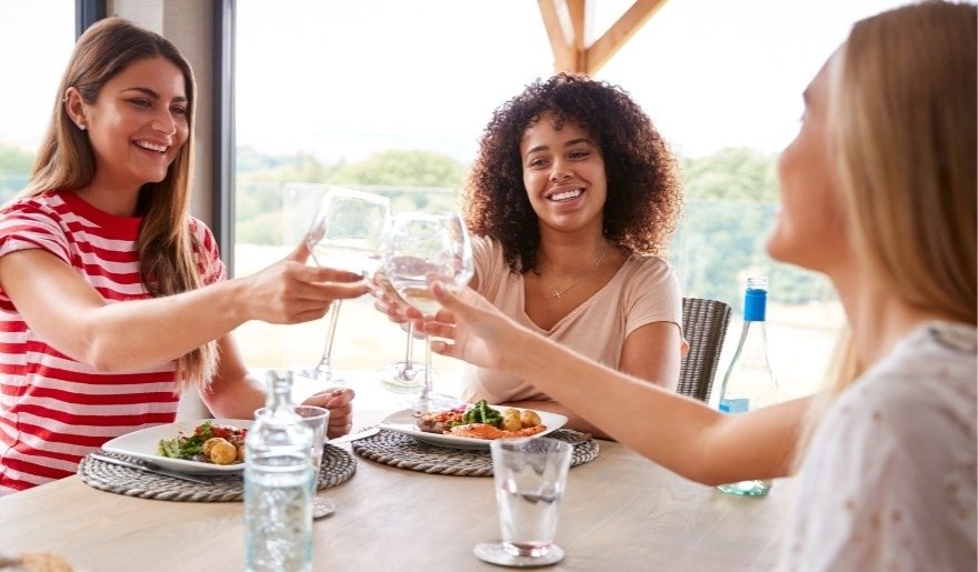 Friends enjoying brunch and drinks during a Myrtle Beach bachelorette party celebration