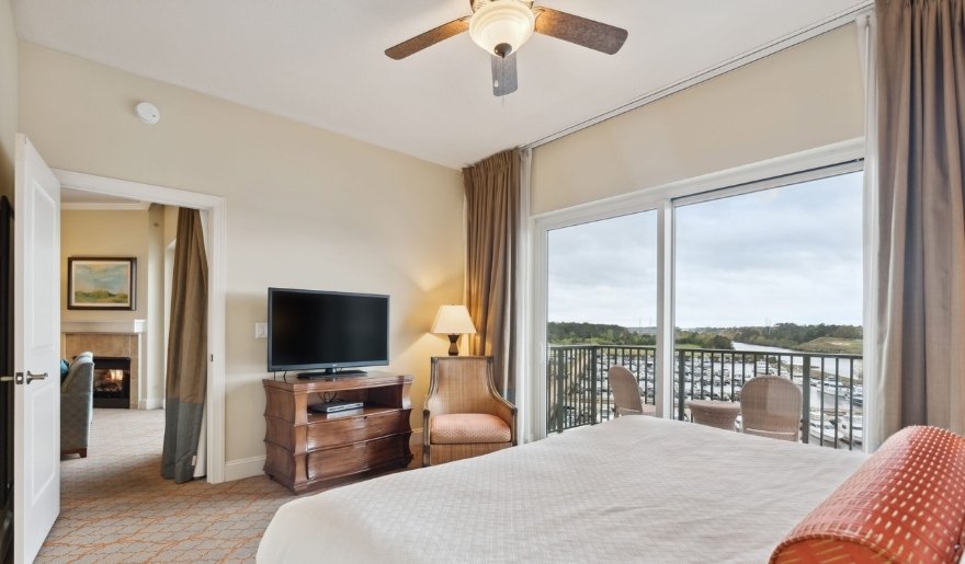Luxury guest room with marina-view balcony at Marina Inn at Grande Dunes perfect stay during Myrtle Beach in August