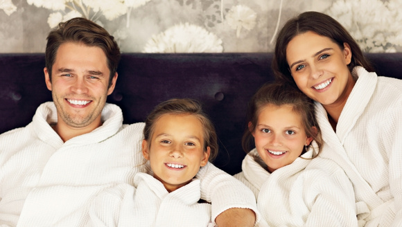Family relaxing in spa robes during a luxury Myrtle Beach getaway at Marina Inn
