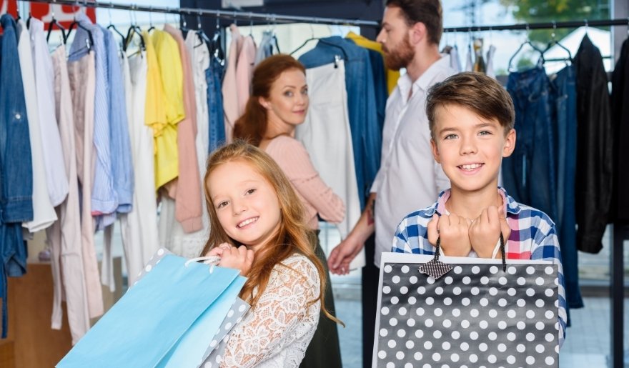 Family shopping with bags at Tanger Outlets Myrtle Beach on Highway 17