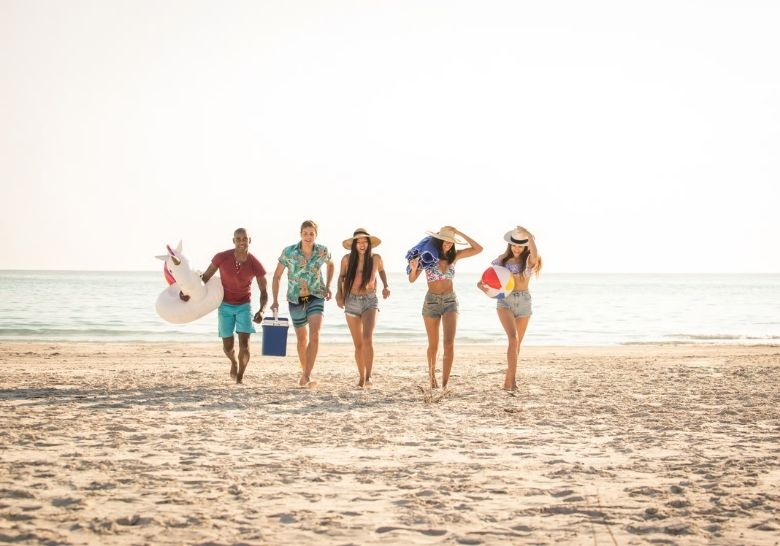 Adults enjoying a Myrtle Beach beach day near Best Hotel in Myrtle Beach For Adults.