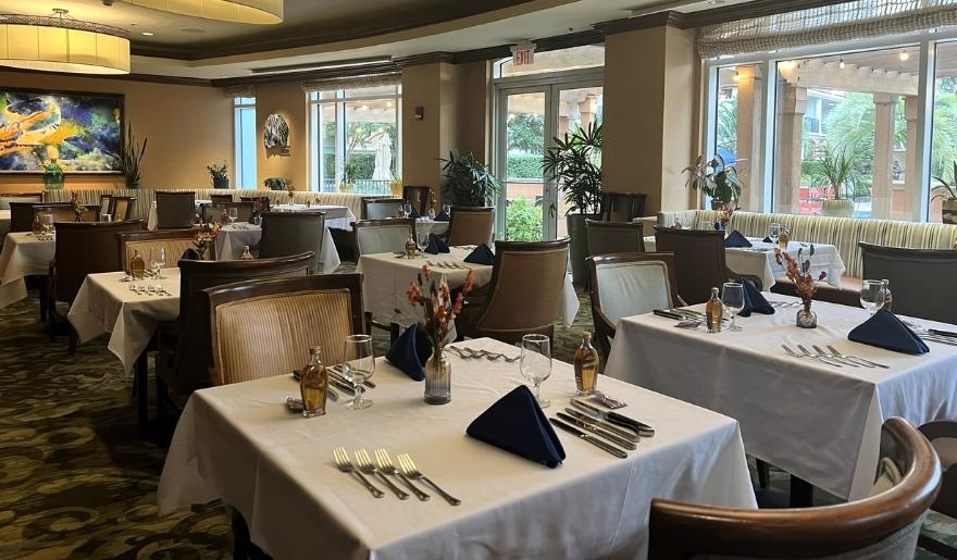 Waterscapes Restaurant dining room in Myrtle Beach with elegant tables set for Thanksgiving dinner.